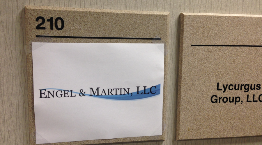 Office temporary sign in lobby of Engel & Martin, LLC